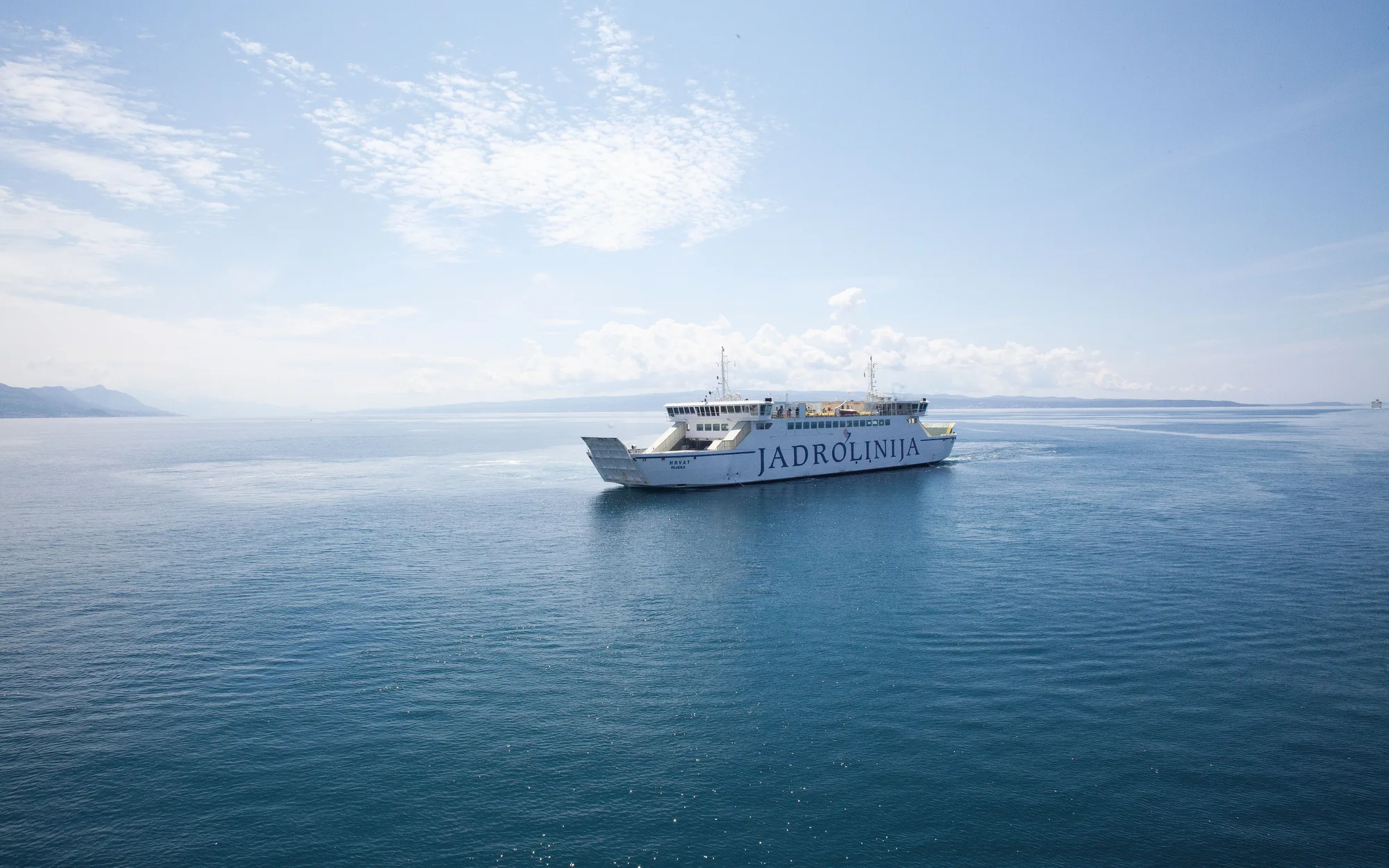 A car ferry crossing to the islands