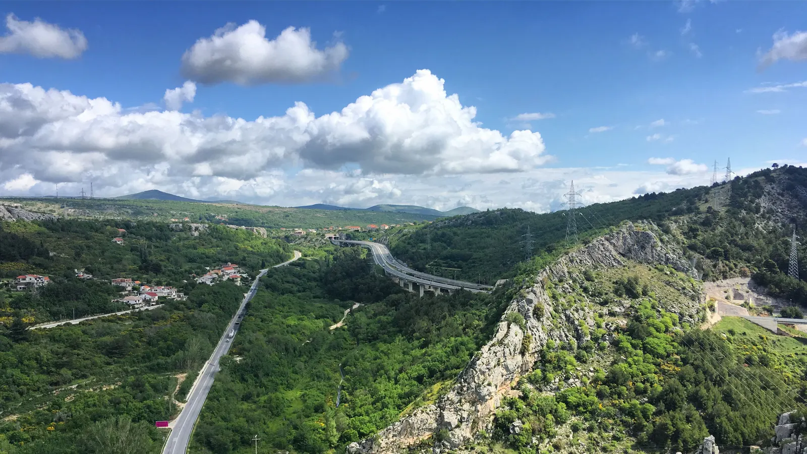 A road threading through wooded karst