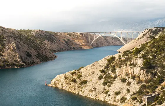 The Pag bridge crossing the channel between limestone cliffs
