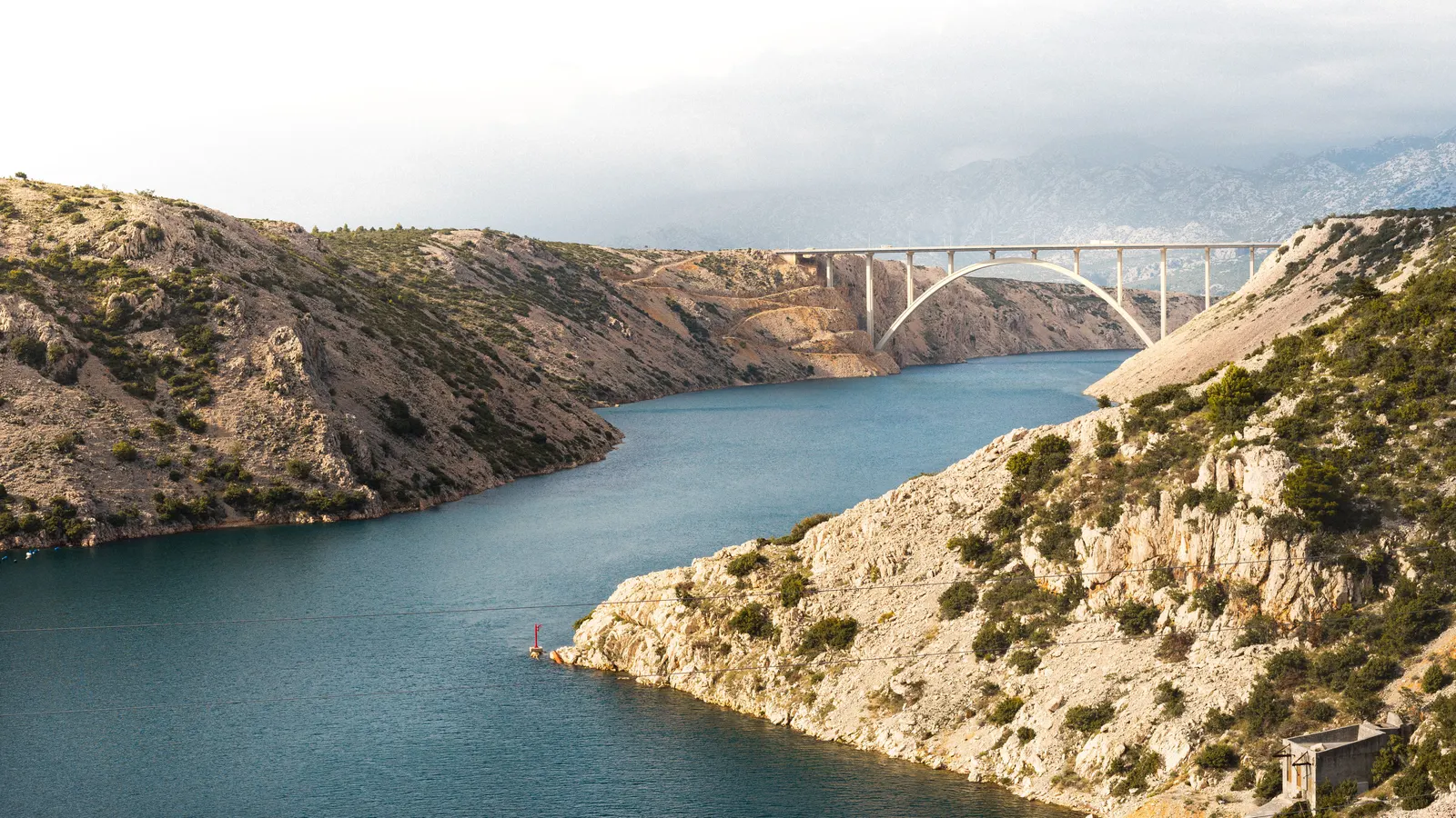 The Pag bridge crossing the channel between limestone cliffs