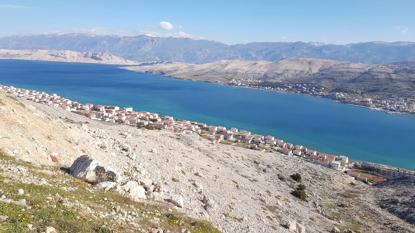 The bare karst of Pag with the Velebit behind