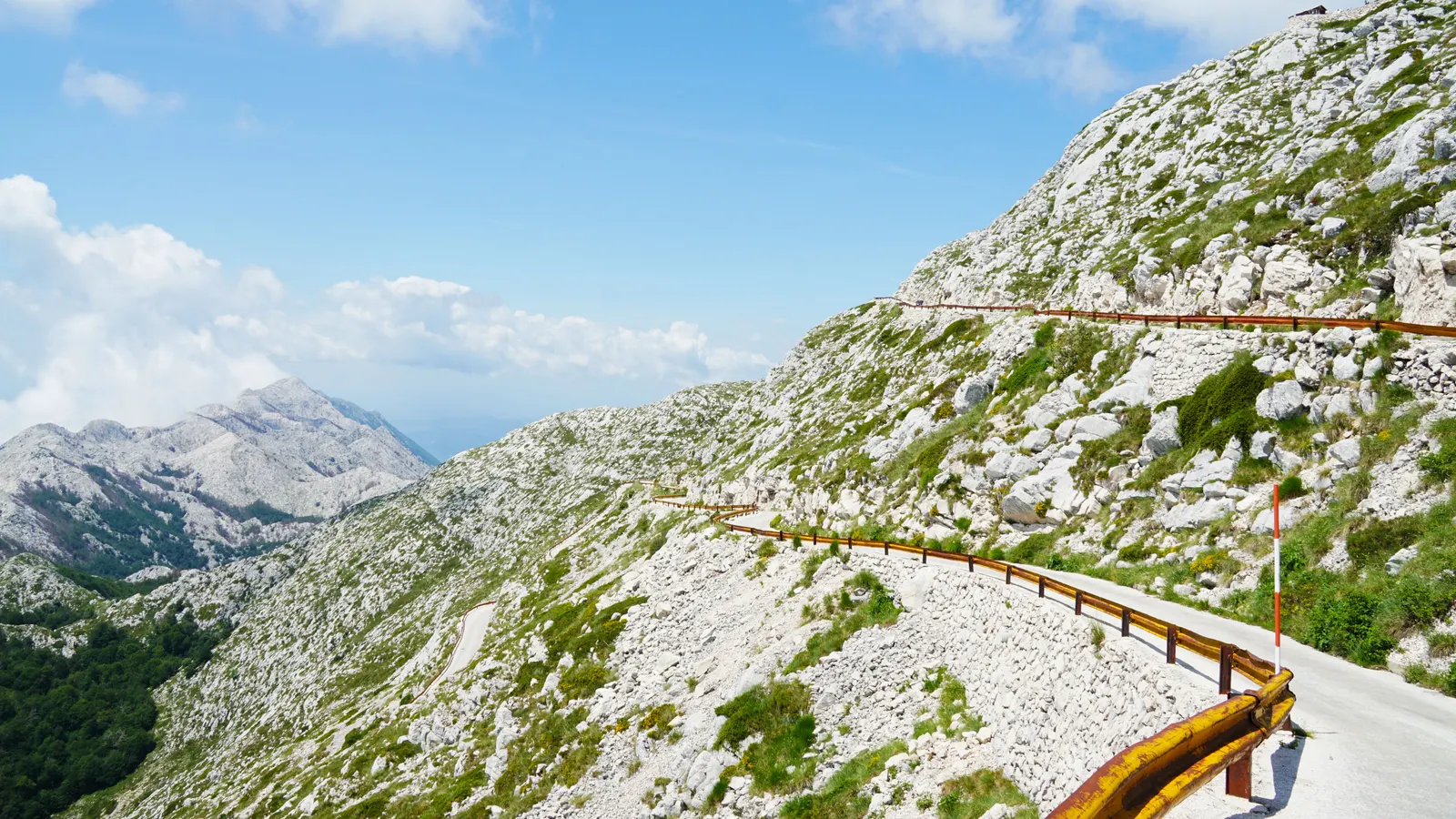 A pass road climbing through the Velebit above the sea